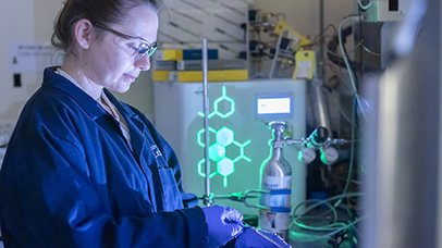 A member of the CEHS team using scientific equipment in a laboratory