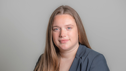 Headshot photograph of Katie Eminson