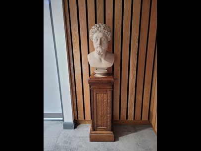 Bust of Marcus Aurelius on a wooden plinth. 