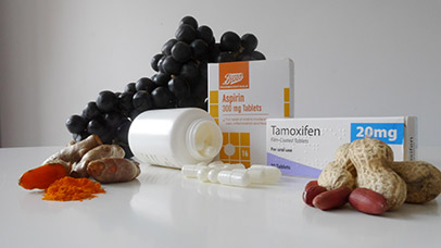 Grapes, Dates, Turmeric, Nuts and medicine on a table