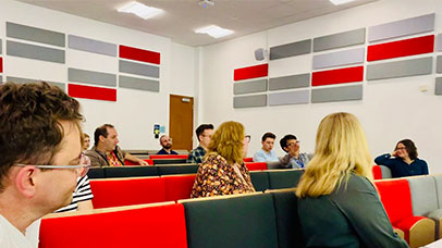 People sitting in a lecture theatre.