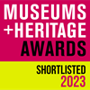 Pink and yellow square logo with text reading 'Museums and Heritage Awards Shortlisted 2023'