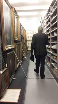 Man walking amongst museum objects