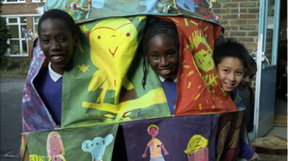 Children peering out of a tent