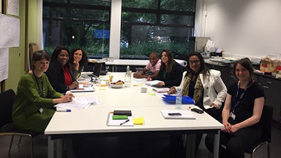 Scholars gathered around a table