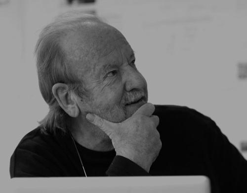 Black and white image of a man with his hand on his chin (Steve Simons)