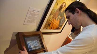 A man interacting with a screen