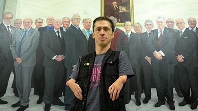 Mat Fraser standing in front of a painting