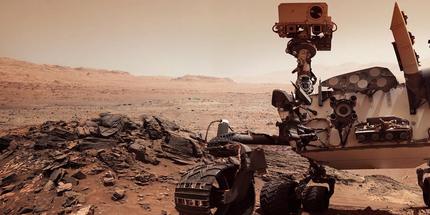 mars rover out on patrol over vast red dust land