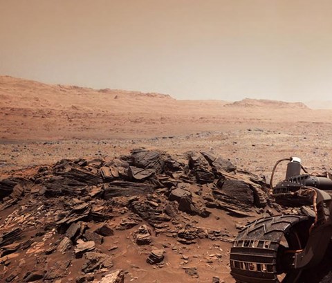 mars rover out on patrol over vast red dust land