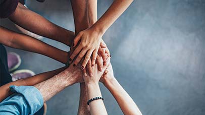 people holding hands in support