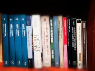 A shelf with books on it. 