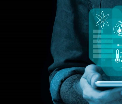 Person holding a tablet with different type of data on the screen.