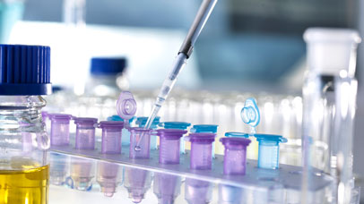 Pipette dropping liquid into test tubes.