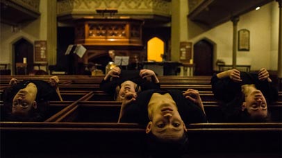 Four people laying on their backs