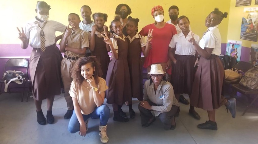 Photo of Haile Selassie students with dancehall artist Cecile