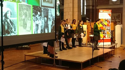 Children presenting at an event.