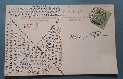 Reverse side of the postcard from Chatham, featuring an unusual cipher.