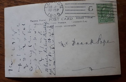 Reverse side of a postcard addressed to Frank Pope. The left hand side is written in shorthand characters.