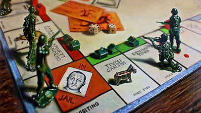 Jamaican version of Monopoly with toy soldiers on the board.