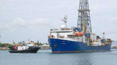 Large boat and smaller boat on the water