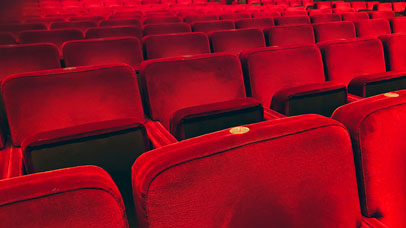 Row of red chairs in a theatre