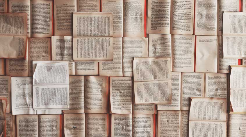 Book pages laid out flat on a table
