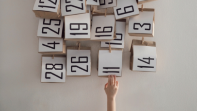 Calendar tree with hand reaching up
