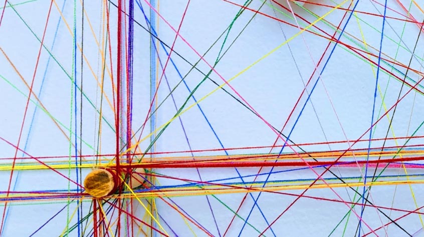 cotton threads attached to pins