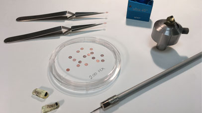 Petri dish and other bits of equipment on a table