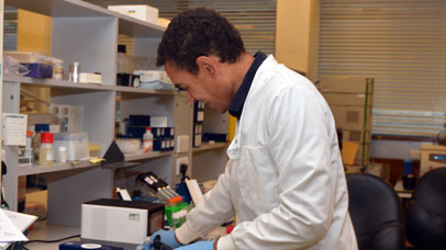 Member of staff in a lab.