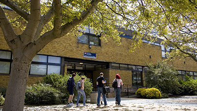 Campus building  and people walking outside at the University of Leicester