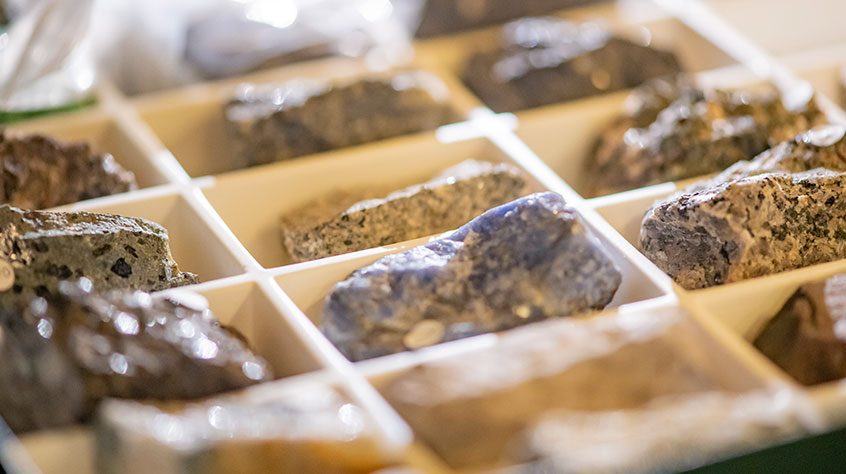 Rock samples in a wooden container