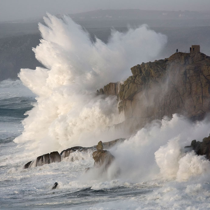 Waves crashing on a rock