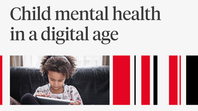 Child reading from a tablet on a sofa