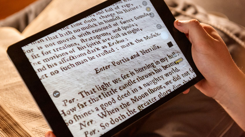 Tablet with old English on the screen