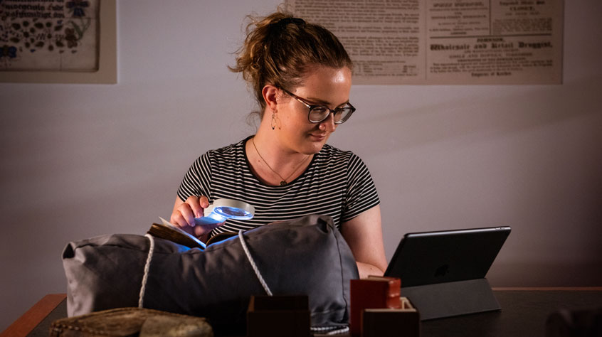 Person sat looking at a tablet