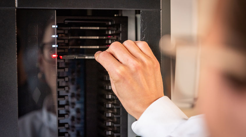 Person putting samples into a machine