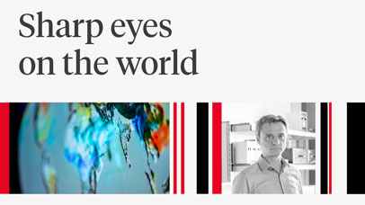 Professor Hartmut Boesch next to an image of the earth seen from space