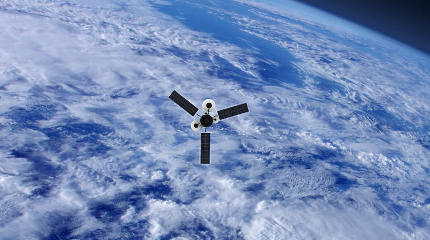 A satellite floating in space with the earth in the background