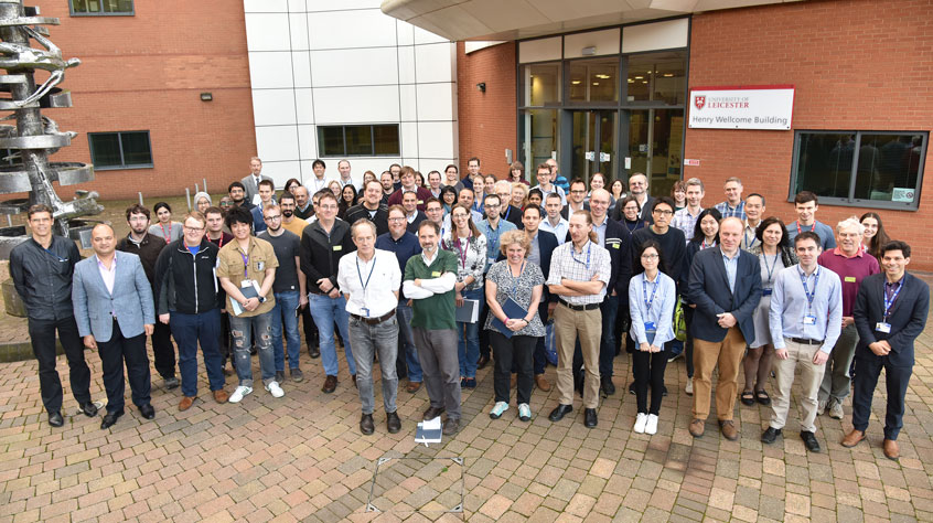 Institute of Structural and Chemical Biology posing for photo outside the Henry Welcome building