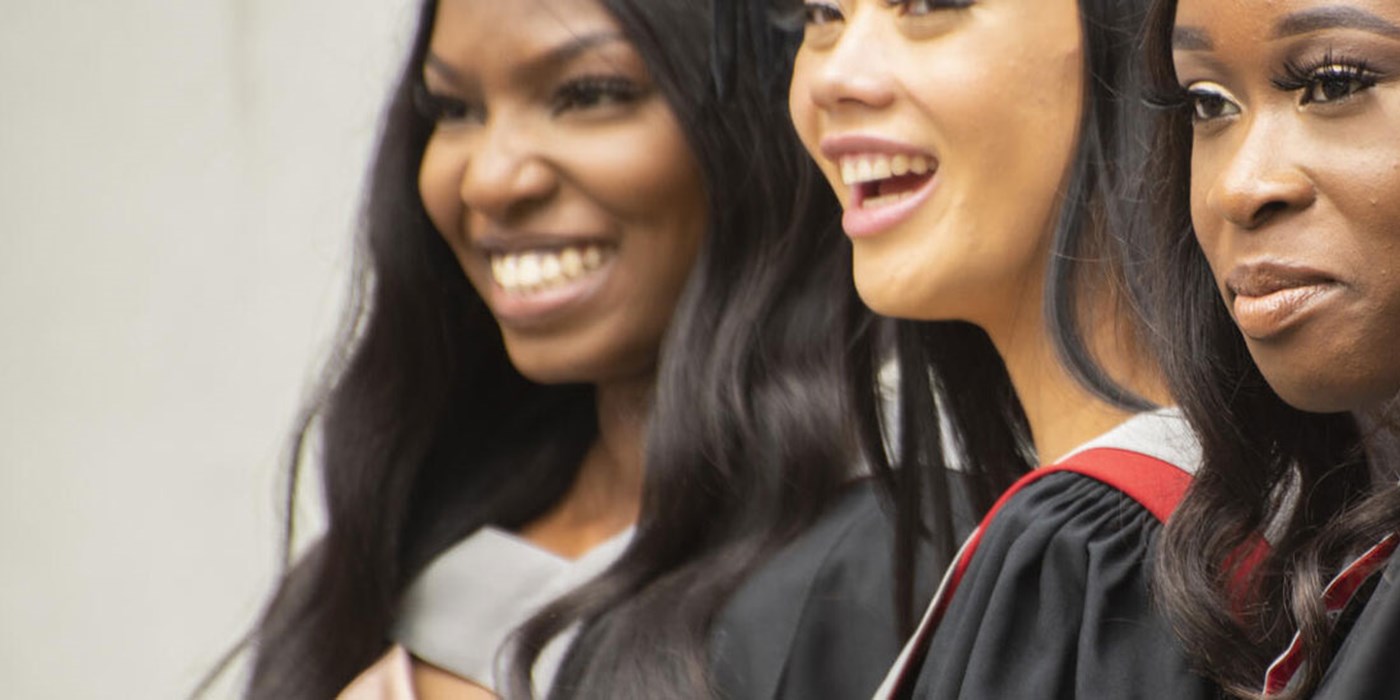 Graduating students smiling 
