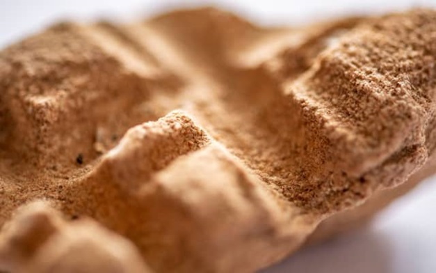 Close up of a bronzed artefact.