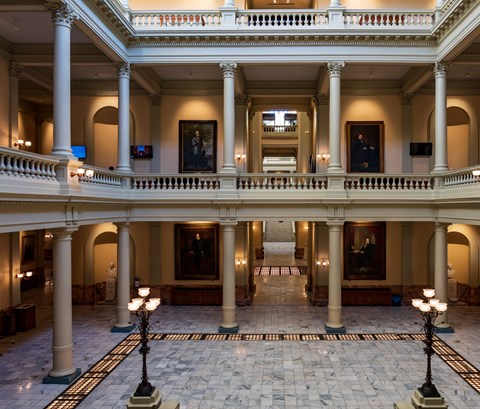 internior shot of inside a museum showing the main area and the floor above