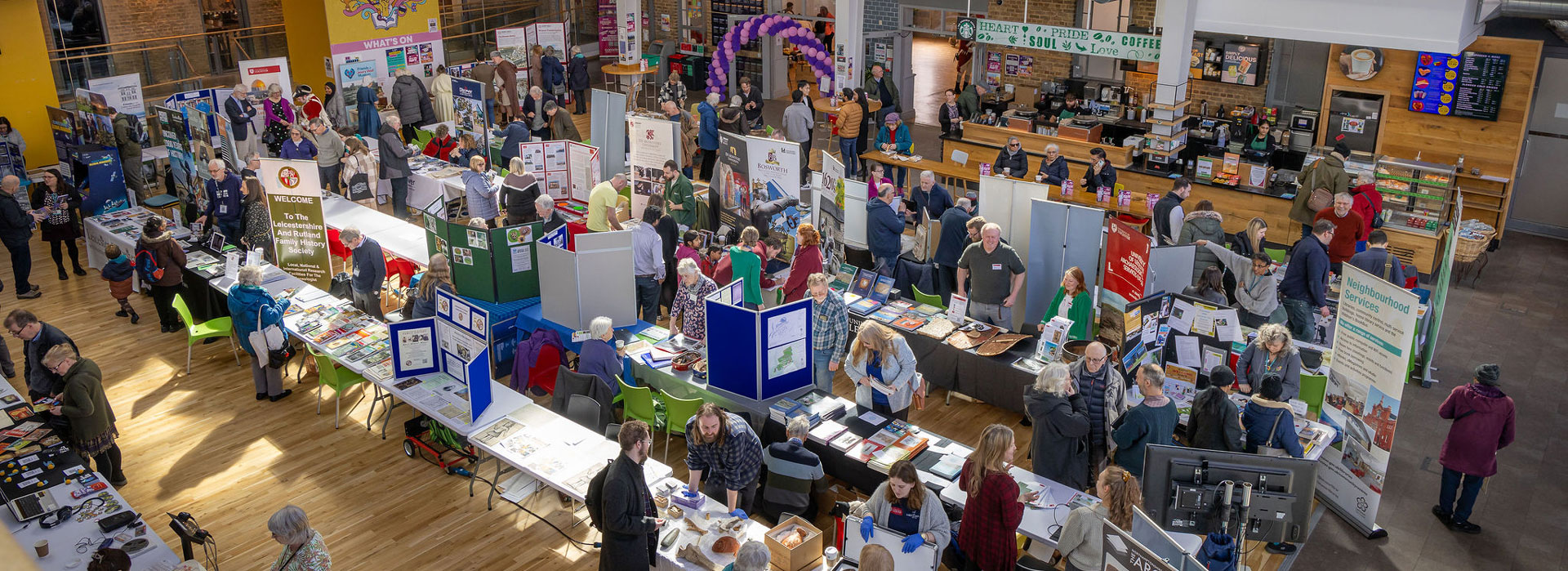 Birdseye view of stalls at a fair in the Students' Union on Leicester campus.