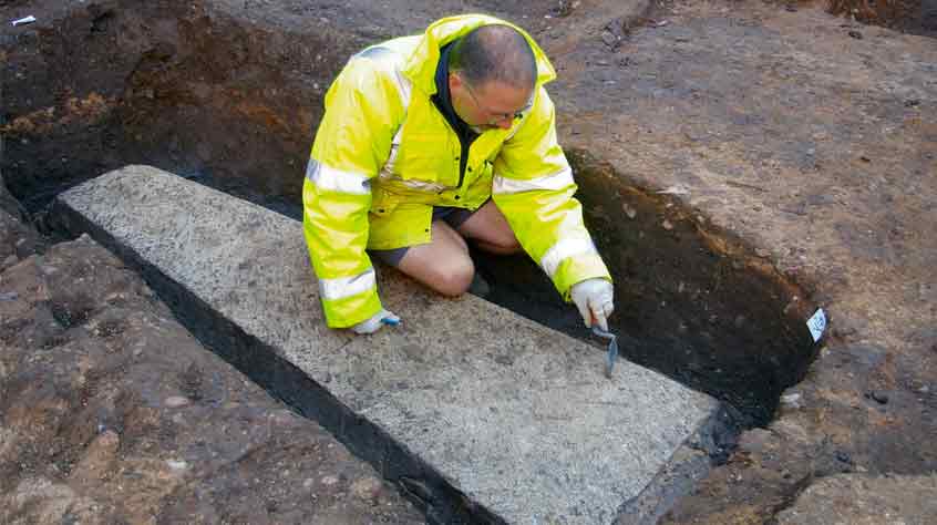 Archaeologist Leon Hunt uncovers a large medieval stone coffin.