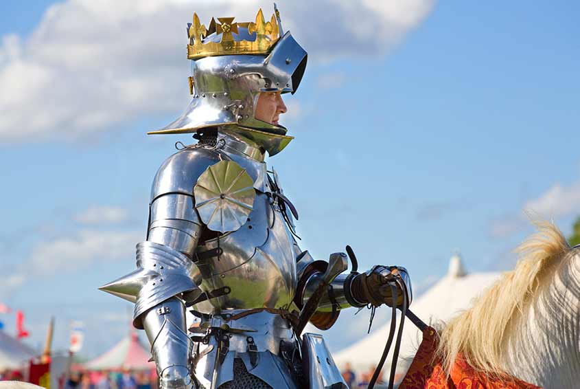 A modern re-enactor portraying Richard III. He is dressed in metal-plate armour of a type common in the late 15th century.