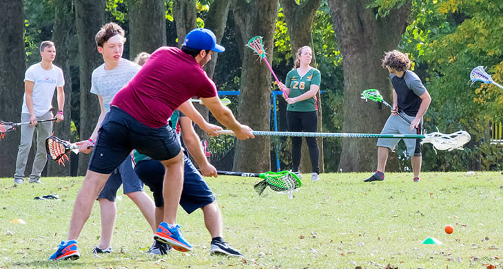 lacrosse players in park