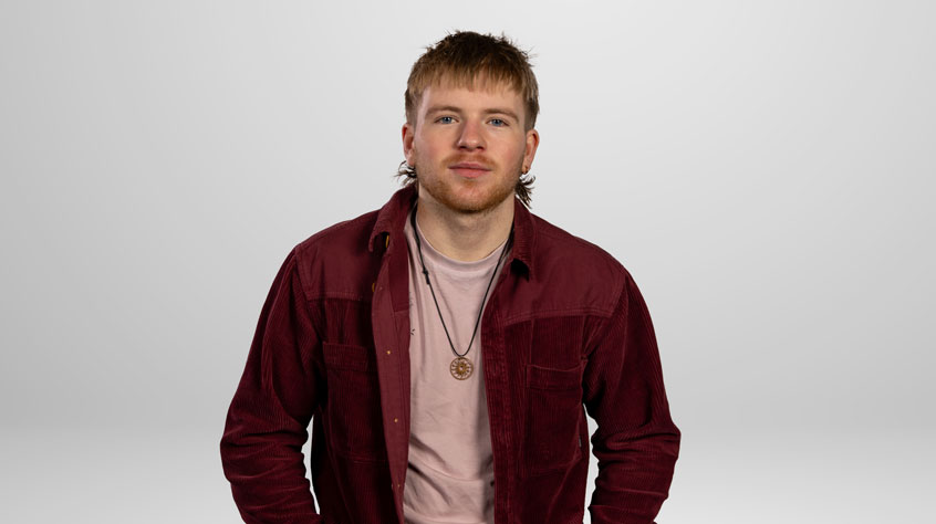 Student Jude posing for a photo in a studio