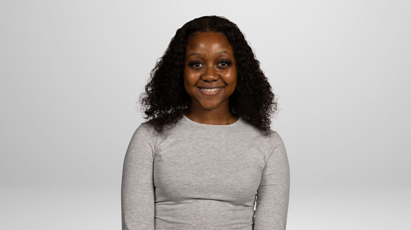 Student Natasha posing for a photo in a studio